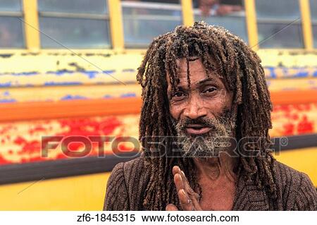 Stock Photography - Colorful portrait of native man with dreadlocks in Belize. Fotosearch