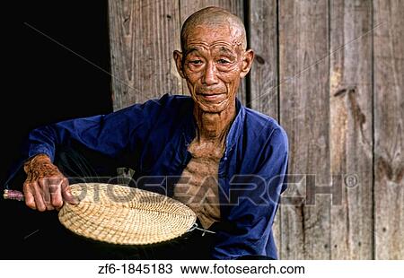 Colorful portrait of old man on Fan Li River in Guilin China View Large Photo Image Stock Image - Colorful portrait of old man on Fan Li River in Guilin China. Fotosearch