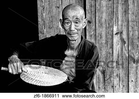 Colorful portrait of old man on Fan Li River in Guilin China View Large Photo Image Stock Image - Colorful portrait of old man on Fan Li River in Guilin China. Fotosearch