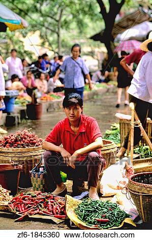 Colorful portrait of street vendor selling chilies in Yangshou China. View Large Photo Image Stock Image - Colorful portrait of street vendor selling chilies in Yangshou China.. Fotosearch