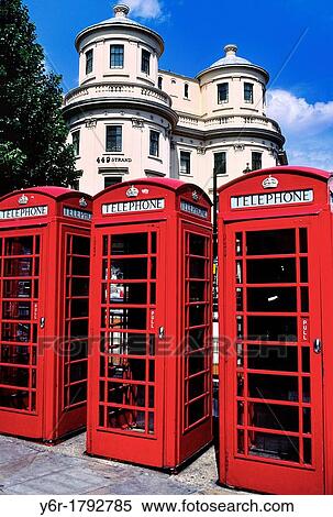 Colorful red telephone boxes in The Strand in sunny London, England, against a background of J Nash architecture and blue skies, View Large Photo Image Stock Photography - Colorful red telephone boxes in The Strand in sunny London, England, against a background of J Nash architecture and blue skies,. Fotosearch