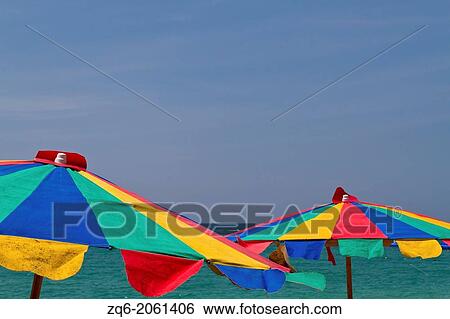 Colorful Sun Shades at Mai Khao Beach on Phuket, Thailand. View Large Photo Image Stock Photograph - Colorful Sun Shades at Mai Khao Beach on Phuket, Thailand.. Fotosearch