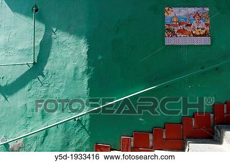 Stock Photograph - colorful wall decorated wiith mosaic of ceramic tiles, old town of Vietri sul Mare, Amalfi Coast, Campania region, southern Italy, Mediterranean Sea, Italy, Europe. Fotosearch