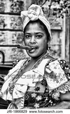 Colorful woman in costume with flowers and cigar in Old Havana Habana in Cuba View Large Photo Image Stock Photo - Colorful woman in costume with flowers and cigar in Old Havana Habana in Cuba. Fotosearch