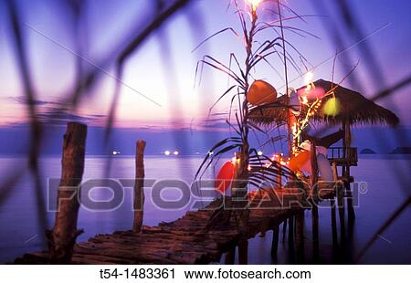 Colorfully illuminated bar with a small Pavilion at sea on Ko Chang View Large Photo Image Stock Image - Colorfully illuminated bar with a small Pavilion at sea on Ko Chang. Fotosearch