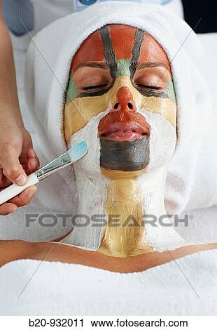 Stock Image - Colour energy, mud mask for facial treatment, Spa-relais. Fotosearch