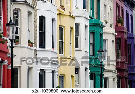 Stock Image - Colourful terraced houses in Notting Hill, London, England. Fotosearch