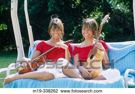 Stock Image - Columbian identical twins. Fotosearch