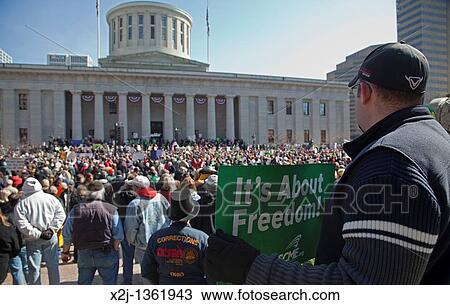Stock Image - Columbus, Ohio - Union members rally at the Statehouse against SB5, a bill promoted by Ohio Governor John Kasich that would restrict collective bargaining rights for public employees. Fotosearch