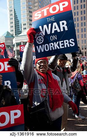 Columbus, Ohio - Union members rally at the Statehouse against SB5, a bill promoted by Ohio Governor John Kasich that would restrict collective bargaining rights for public employees View Large Photo Image Stock Photograph - Columbus, Ohio - Union members rally at the Statehouse against SB5, a bill promoted by Ohio Governor John Kasich that would restrict collective bargaining rights for public employees. Fotosearch