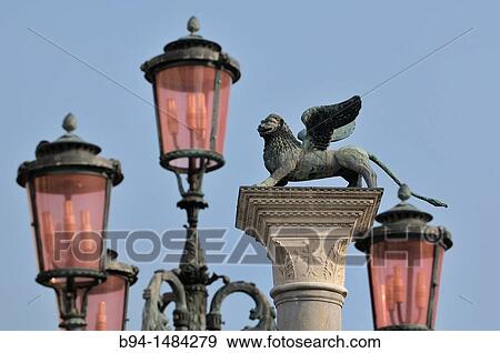 Column with a statue of winged lion, symbol of St Mark, Piazzetta di San Marco, Venice, Veneto, Italy View Large Photo Image Stock Photo - Column with a statue of winged lion, symbol of St Mark, Piazzetta di San Marco, Venice, Veneto, Italy. Fotosearch