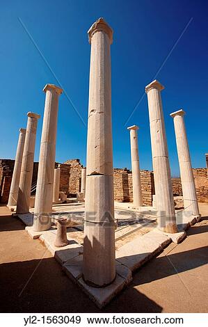 Stock Photo - Columns of the House of Dionysos in the ruins of the Greek city of Delos, the birthplace of the twin gods Apollo and Artemis. Fotosearch