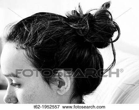 Comfortable and modern hairstyle for a teenage girl. White and Black. View Large Photo Image Stock Photo - Comfortable and modern hairstyle for a teenage girl. White and Black.. Fotosearch