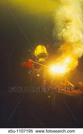 Commercial diver welding underwater View Large Photo Image Stock Photography - Commercial diver welding underwater. Fotosearch