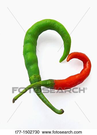 Common Chili Capsicum annuum Red and green chilies are kept in heart like shape View Large Photo Image Stock Image - Common Chili Capsicum annuum Red and green chilies are kept in heart like shape. Fotosearch