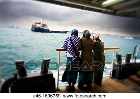 Commuters on Bosphorus ferry Istanbul Turkey. View Large Photo Image Stock Photo - Commuters on Bosphorus ferry Istanbul Turkey.. Fotosearch
