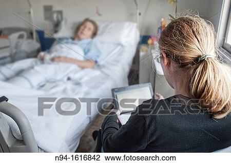 Companion for a sick family, in the hospital. View Large Photo Image Stock Image - Companion for a sick family, in the hospital.. Fotosearch