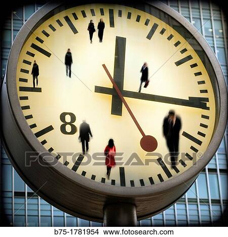 Picture - composicion digital, primer plano de la esfera de un reloj con personas y marcando la hora, Digital Composition, closeup of a clock sphere with people in time. Fotosearch