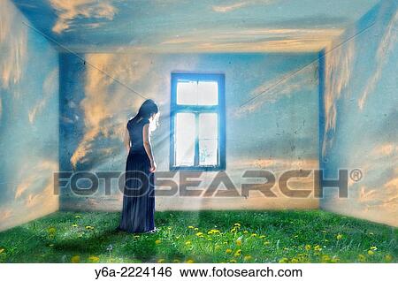 Stock Photograph - Composite image of a woman standing by the window and grass and clouds.. Fotosearch