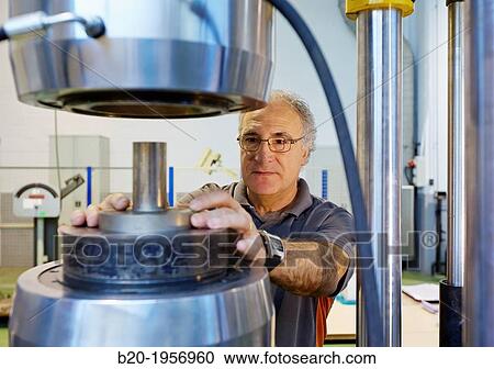 Stock Image - Compression test. Mechanical Testing Laboratory. Technological Services to Industry. Tecnalia Research & Innovation, Donostia, San Sebastian, Gipuzkoa, Basque Country, Spain.. Fotosearch