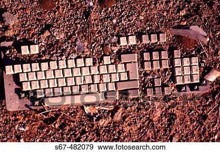 Computer keyboard half buried in earth. Next to Glorias, Barcelona. Catalonia. Spain. View Large Photo Image Stock Photo - Computer keyboard half buried in earth. Next to Glorias, Barcelona. Catalonia. Spain.. Fotosearch