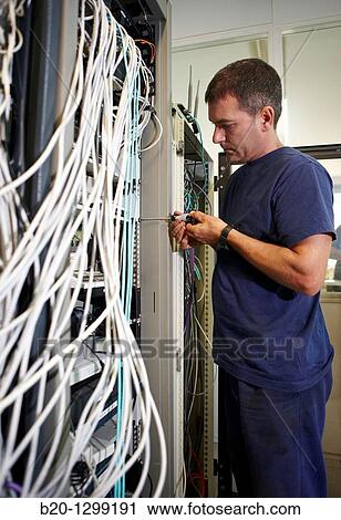 Computer maintenance, networking cables, man using screwdriver View Large Photo Image Stock Image - Computer maintenance, networking cables, man using screwdriver. Fotosearch
