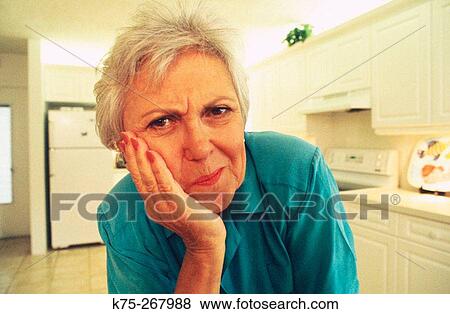 Stock Photo - Concerned senior woman. Fotosearch