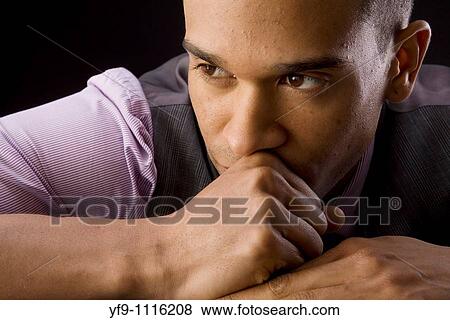 Concerned young businessman. View Large Photo Image Stock Photo - Concerned young businessman.. Fotosearch