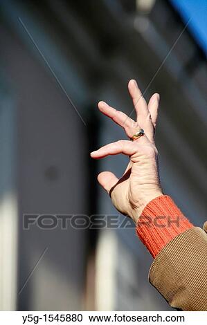 conductor with raised hand at outdoor concert View Large Photo Image Stock Image - conductor with raised hand at outdoor concert. Fotosearch