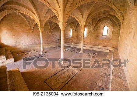 Picture - Conference hall with ground tombstones for the principals of the monastery, Monastery of Santes Creus, Spain.. Fotosearch