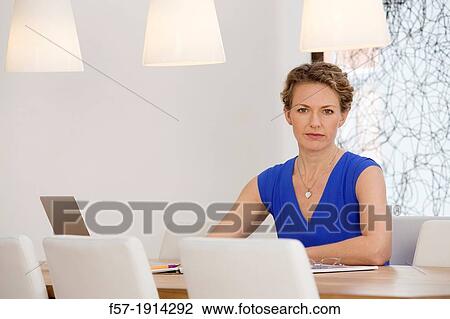 Confident young businesswoman working View Large Photo Image Stock Image - Confident young businesswoman working. Fotosearch