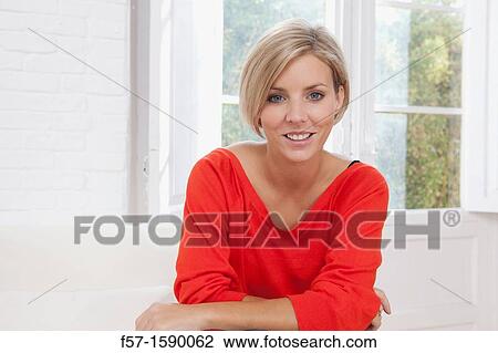Confident young women at home View Large Photo Image Stock Image - Confident young women at home. Fotosearch