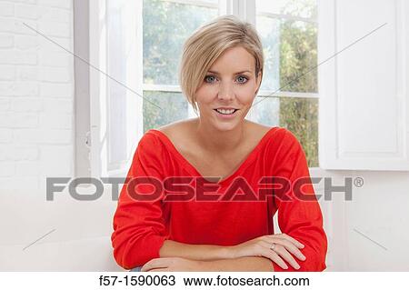 Confident young women at home View Large Photo Image Stock Image - Confident young women at home. Fotosearch