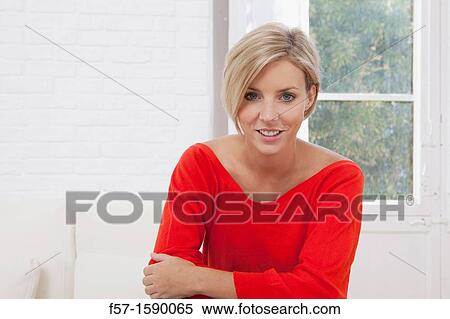 Confident young women at home View Large Photo Image Stock Photography - Confident young women at home. Fotosearch