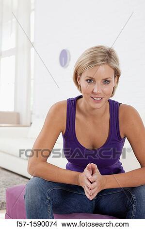 Confident young women in her loft apartment View Large Photo Image Picture - Confident young women in her loft apartment. Fotosearch