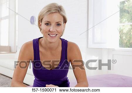 Confident young women in her loft apartment View Large Photo Image Stock Image - Confident young women in her loft apartment. Fotosearch