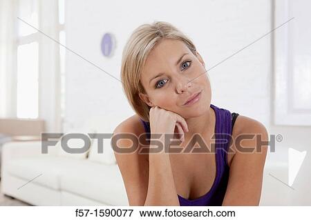 Confident young women in her loft apartment View Large Photo Image Stock Photo - Confident young women in her loft apartment. Fotosearch