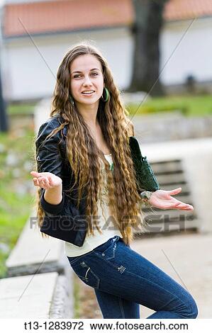 Stock Image - Confused young woman. Fotosearch