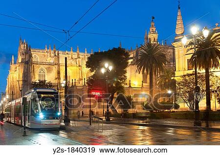 Constitution Avenue Cathedral and Metrocentro tram, Seville, Spain View Large Photo Image Stock Photo - Constitution Avenue Cathedral and Metrocentro tram, Seville, Spain. Fotosearch