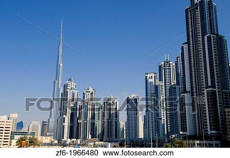 Construction and new skyline of amazing Dubai UAE with the world's tallest building Burj Khalifa at 2722 feet and 162 stories in thriving new United Arab Emirates in Middle East in Gulf States. View Large Photo Image Stock Image - Construction and new skyline of amazing Dubai UAE with the world's tallest building Burj Khalifa at 2722 feet and 162 stories in thriving new United Arab Emirates in Middle East in Gulf States.. Fotosearch