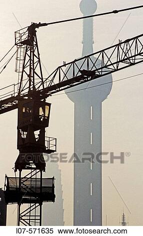 Construction crane and Oriental Pearl Tower. Shanghai. China View Large Photo Image Stock Photography - Construction crane and Oriental Pearl Tower. Shanghai. China. Fotosearch