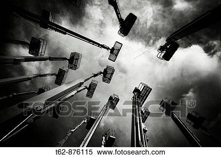 Construction cranes are stored while waiting for work Economic crisis View Large Photo Image Stock Photography - Construction cranes are stored while waiting for work Economic crisis. Fotosearch