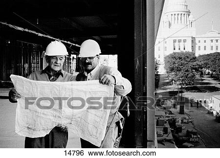 Construction foreman and worker reviewing blueprint View Large Photo Image Stock Photograph - Construction foreman and worker reviewing blueprint. Fotosearch
