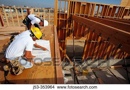 Construction foreman giving instructions to carpenters on jobsite for school construction, Antelope California USA View Large Photo Image Picture - Construction foreman giving instructions to carpenters on jobsite for school construction, Antelope California USA. Fotosearch