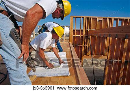Construction foreman giving instructions to carpenters on jobsite for school construction, Antelope California USA View Large Photo Image Stock Image - Construction foreman giving instructions to carpenters on jobsite for school construction, Antelope California USA. Fotosearch