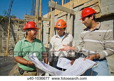 Construction site, architects with blue prints View Large Photo Image Stock Photo - Construction site, architects with blue prints. Fotosearch