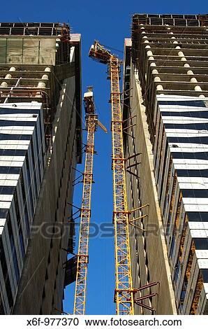 Construction site of the Acico Twin Towers in Sheikh Zayed Road, Dubai, United Arab Emirates View Large Photo Image Stock Image - Construction site of the Acico Twin Towers in Sheikh Zayed Road, Dubai, United Arab Emirates. Fotosearch