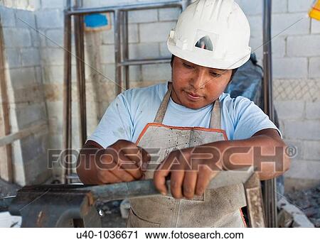 Stock Image - Construction site worker. Fotosearch