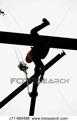 Construction steel iron worker hoisting steel in silhouette View Large Photo Image Stock Photograph - Construction steel iron worker hoisting steel in silhouette. Fotosearch