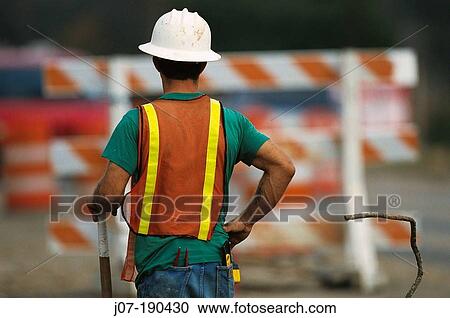 Construction worker and safety fence. Texas. USA View Large Photo Image Stock Image - Construction worker and safety fence. Texas. USA. Fotosearch